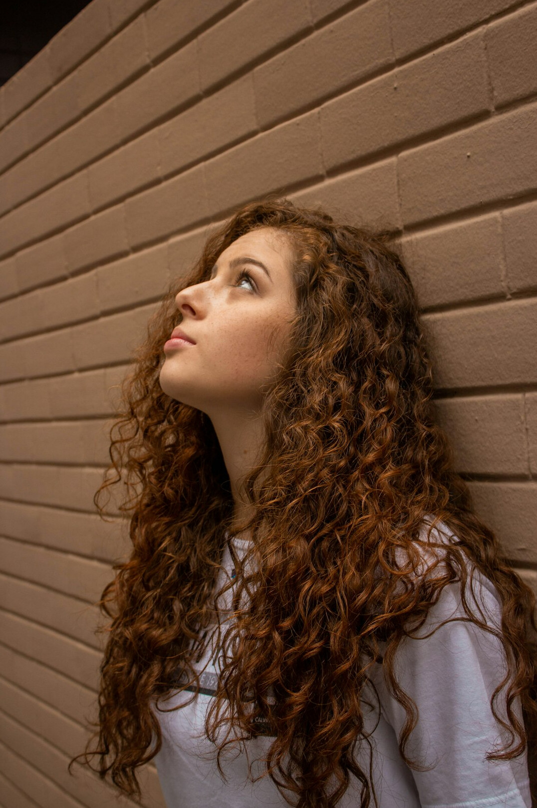 Portrait of a young woman with curly hair