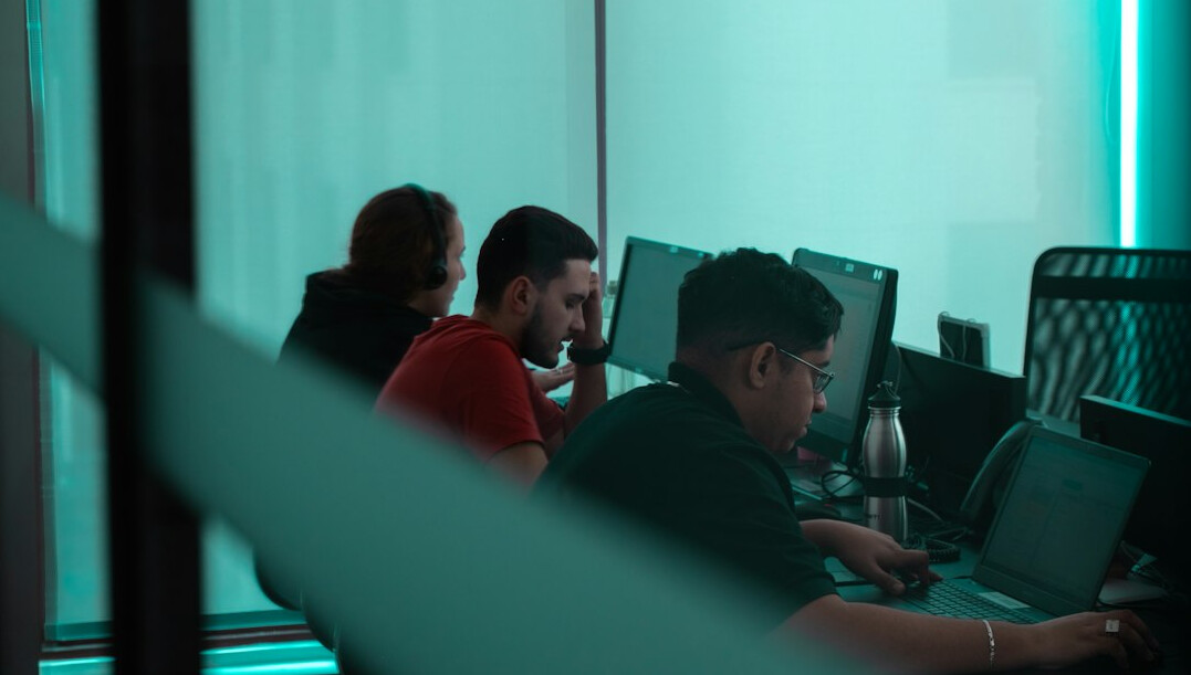 group of people coding together
